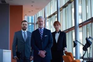 senior business man with his team at office photo