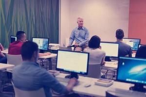 teacher and students in computer lab classroom photo