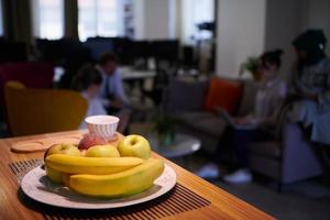 a bowl of fresh fruits at modern startup office photo