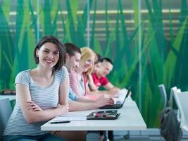 group of students study together in classroom photo