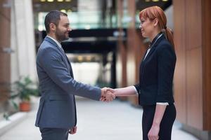 business man and woman hand shake photo