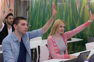 students group raise hands up photo