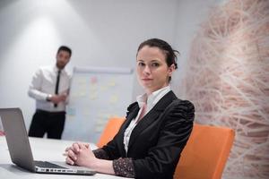 young business woman on meeting  using laptop computer photo