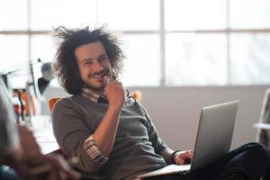 businessman working using a laptop in startup office photo
