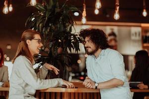 business couple sits in a cafe after a weekday photo