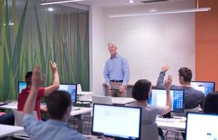 teacher and students in computer lab classroom photo