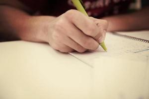 student hand underlining a document photo