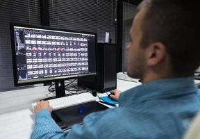 photo editor at his desk