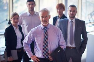 senior business man with his team at office photo