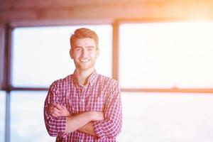 portrait of young casual businessman on construction site photo