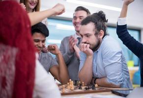 multiethnic group of business people playing chess photo