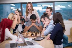 multiethnic group of business people playing chess photo