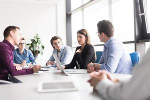 Business Team At A Meeting at modern office building photo