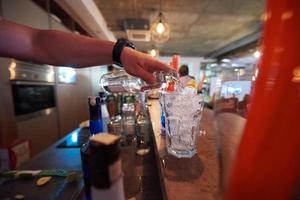 barman prepare fresh coctail drink photo