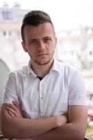 man standing at balcony photo