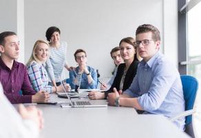 Business Team At A Meeting at modern office building photo