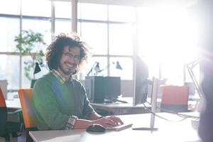 businessman working using a computer in startup office photo