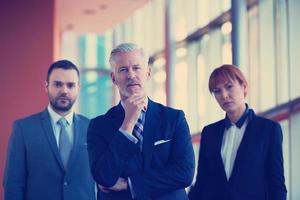 senior business man with his team at office photo