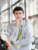 portrait of young business man at modern office photo