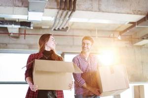 business team carrying cardboard boxes photo