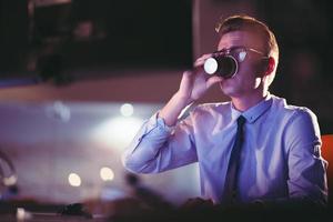 Tired businessman working late photo