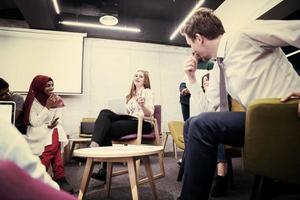 Multiethnic startup business team having meeting photo