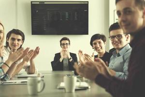 Group of young people meeting in startup office photo