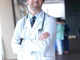 group of medical staff at hospital, doctor in front of team photo