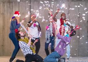 multiethnic group of casual business people having confetti party photo