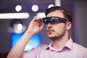 man using virtual reality gadget computer glasses photo