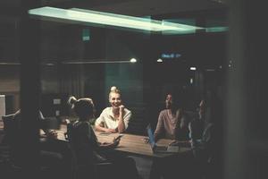 Multiethnic startup business team in night office photo