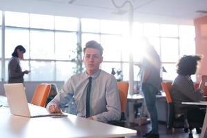 businessman working using a laptop in startup office photo