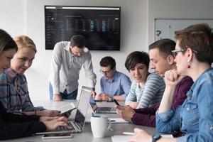 Group of young people meeting in startup office photo