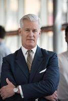 portrait of handsome senior business man at modern office photo