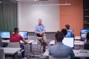 teacher and students in computer lab classroom photo