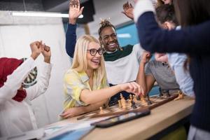 multiethnic group of business people playing chess photo