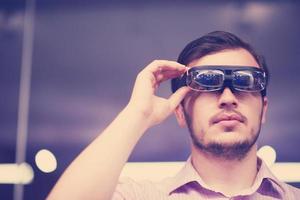 man using virtual reality gadget computer glasses photo