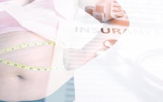 Double exposure of women body fat with measure tape and Health insurance form. Health care concept. photo