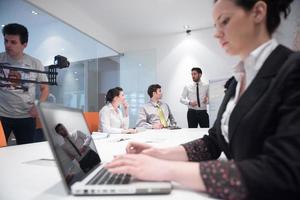 young business woman on meeting  using laptop computer photo