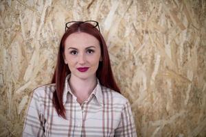 portrait of young redhead business woman photo
