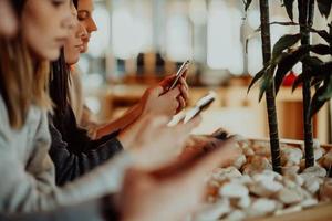 macro photo of young people using the phone during a break from work.free space