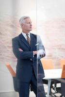 portrait of handsome senior business man at modern office photo