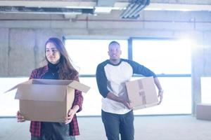 multiethnic business team carrying cardboard boxes photo