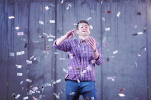 businessman making the rain of money photo