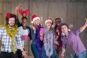 multiethnic group of casual business people dancing with sparklers photo