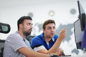 two male software developers working on computer photo
