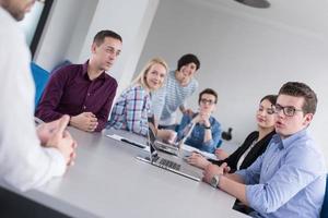 Business Team At A Meeting at modern office building photo