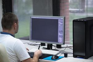 photo editor at his desk