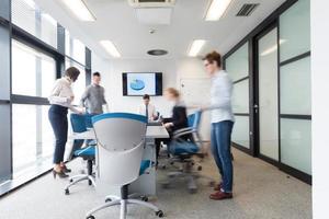 business people group entering meeting room, motion blur photo