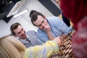 multiethnic group of business people playing chess photo